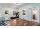 The bonus room has a treadmill and multiple windows at 1292 Eubanks Ave, East Point, GA 30344