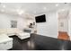 Spacious living area offering dark hardwood floors, white walls, and views of kitchen and dining area at 1292 Eubanks Ave, East Point, GA 30344