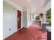 Inviting porch featuring a decorated front door, with lighting and freshly painted siding at 1292 Eubanks Ave, East Point, GA 30344
