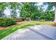 Spacious backyard with a gray wood deck and lush green lawn at 2007 Mount Vernon Pl, Dunwoody, GA 30338