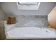 Bathroom with skylight, and jacuzzi tub with marble tile at 2007 Mount Vernon Pl, Dunwoody, GA 30338