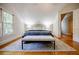 Bedroom with hardwood floors, rug, bench, and natural light at 2007 Mount Vernon Pl, Dunwoody, GA 30338