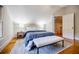Bedroom with hardwood floors, rug, bench, and natural light at 2007 Mount Vernon Pl, Dunwoody, GA 30338