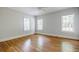 Sunlit bedroom with hardwood floors and neutral-colored walls at 2007 Mount Vernon Pl, Dunwoody, GA 30338
