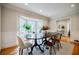 Spacious dining room with a bay window, modern decor, and hardwood floors, ideal for Gathering gatherings at 2007 Mount Vernon Pl, Dunwoody, GA 30338