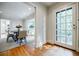 Elegant dining room featuring hardwood floors, a round table, and access to a patio, great for entertaining at 2007 Mount Vernon Pl, Dunwoody, GA 30338