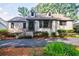 Charming brick home featuring unique dormers, dark trim, and mature landscaping at 2007 Mount Vernon Pl, Dunwoody, GA 30338