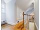 Hallway with hardwood floors, large storage closets, and staircase to basement at 2007 Mount Vernon Pl, Dunwoody, GA 30338