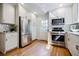 Well-lit kitchen featuring stainless steel appliances and white cabinets at 2007 Mount Vernon Pl, Dunwoody, GA 30338