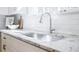 Kitchen sink featuring chrome faucet and white granite countertop at 2007 Mount Vernon Pl, Dunwoody, GA 30338