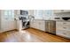 Bright kitchen with stainless steel appliances, white cabinets, and wood floors at 2007 Mount Vernon Pl, Dunwoody, GA 30338
