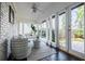 Cozy sunroom with large windows, wicker seating, and a view to the outdoors at 2007 Mount Vernon Pl, Dunwoody, GA 30338