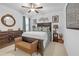 Comfortable bedroom with a wooden bed frame, soft bedding, and decorative accents at 2292 Knob Creek Rd, Snellville, GA 30078