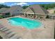 Community pool and lounge area surrounded by seating at 2292 Knob Creek Rd, Snellville, GA 30078