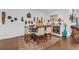 Dining room with a wooden table set, patterned rug, and decorative masks at 2292 Knob Creek Rd, Snellville, GA 30078