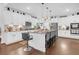 Spacious kitchen with granite countertops, island with barstool seating and white cabinetry at 2292 Knob Creek Rd, Snellville, GA 30078