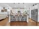 Modern kitchen with island, barstool seating, and stainless steel appliances at 2292 Knob Creek Rd, Snellville, GA 30078