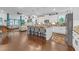 Open-concept kitchen featuring island with barstool seating and stainless fridge at 2292 Knob Creek Rd, Snellville, GA 30078