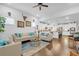 Open-concept living room and kitchen with hardwood floors and bright white cabinets and modern fixtures at 2292 Knob Creek Rd, Snellville, GA 30078