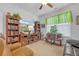 Comfortable living room featuring built-in shelves, TV and decorative accents at 2292 Knob Creek Rd, Snellville, GA 30078