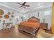 Bright main bedroom featuring trey ceilings, hardwood floors, and decorative wall art at 2292 Knob Creek Rd, Snellville, GA 30078