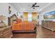 Large main bedroom with trey ceilings, hardwood floors, and a large dresser at 2292 Knob Creek Rd, Snellville, GA 30078