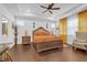 Spacious main bedroom with trey ceilings, hardwood floors, and lots of bright, natural light at 2292 Knob Creek Rd, Snellville, GA 30078