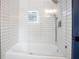The tiled shower and modern tub create a spa-like experience at 4167 Oakwood Way, Duluth, GA 30096