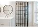 Bathroom with a glass shower door, a vanity with modern fixtures and a mirror at 4167 Oakwood Way, Duluth, GA 30096