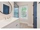 Bathroom with vanity with a mirror, and a blue door at 4167 Oakwood Way, Duluth, GA 30096