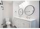 Bathroom featuring double sink vanity, modern fixtures, and neutral color palette at 4167 Oakwood Way, Duluth, GA 30096