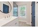 Stylish bathroom vanity features a vessel sink, modern faucet, and a sleek black-framed mirror at 4167 Oakwood Way, Duluth, GA 30096
