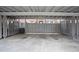 A covered carport features a secure, gated space for parking in front of the townhome at 4167 Oakwood Way, Duluth, GA 30096
