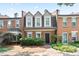 Charming brick townhome with manicured landscaping and a welcoming entrance at 4167 Oakwood Way, Duluth, GA 30096