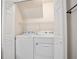 Convenient laundry room with a washer and dryer, perfect for easy chores at 4167 Oakwood Way, Duluth, GA 30096