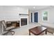 Bright living room featuring a cozy fireplace and stylish modern decor at 4167 Oakwood Way, Duluth, GA 30096