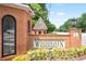A beautifully landscaped sign marks the entrance to the Woodehaven community at 4167 Oakwood Way, Duluth, GA 30096