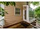 Exterior features a deck-style entrance, offering a private entryway with lush greenery at 7500 Roswell Rd # 18, Sandy Springs, GA 30350