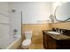 Bathroom featuring a tub-shower, toilet, and a vanity with a black countertop and classic faucet at 7500 Roswell Rd # 18, Sandy Springs, GA 30350