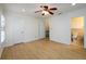 Bedroom includes hardwood floors, ceiling fan, windows, and entries to a closet and the ensuite bathroom at 7500 Roswell Rd # 18, Sandy Springs, GA 30350