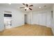 Well-lit bedroom featuring hardwood floors, a ceiling fan, a walk in closet, and an ensuite bathroom at 7500 Roswell Rd # 18, Sandy Springs, GA 30350