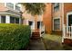 Charming exterior of home with brick accents, a front door, and mature landscaping at 7500 Roswell Rd # 18, Sandy Springs, GA 30350
