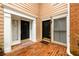 Charming townhome entrances featuring brick flooring and stylish black doors with white trim at 7500 Roswell Rd # 18, Sandy Springs, GA 30350