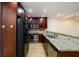 Well-appointed kitchen boasting stainless steel appliances, granite counters, and ample cabinet space at 7500 Roswell Rd # 18, Sandy Springs, GA 30350