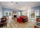 The welcoming living room has wood floors, a fireplace, neutral colors, and french doors to the outside at 7500 Roswell Rd # 18, Sandy Springs, GA 30350
