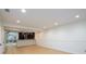 Open concept living room showcasing neutral walls and seamless flow to a dining area at 7500 Roswell Rd # 18, Sandy Springs, GA 30350