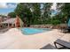 Enjoy the fenced community pool with lounge chairs, mature trees, and plenty of space for everyone at 7500 Roswell Rd # 18, Sandy Springs, GA 30350