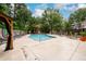 A beautiful community pool is surrounded by lush trees and plenty of space to relax at 7500 Roswell Rd # 18, Sandy Springs, GA 30350
