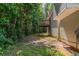 Side view of a backyard with a wooden deck at 1404 Lancaster Ct, Mcdonough, GA 30252