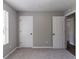 Bedroom featuring a large window, carpet, and two closets at 1404 Lancaster Ct, Mcdonough, GA 30252